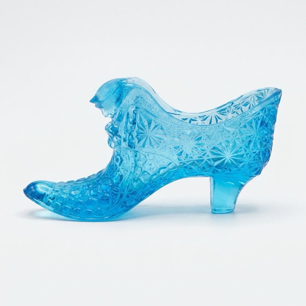 Blue Fenton Art Glass aquamarine 'Daisy and Button' cat head slipper.